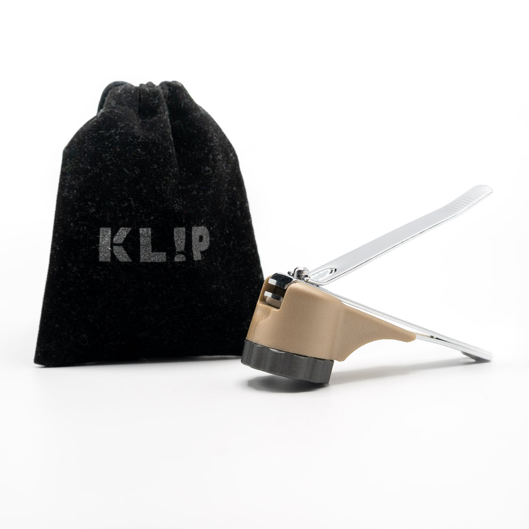 KLIPNAILS nail clipper with nail catcher (Oyster Gray Twist-Off Cap, Metallic Fir Body) with Dk Gray velvet travel pouch.